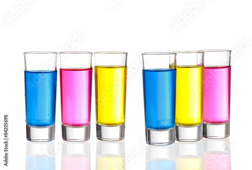 Shots - Three colourful shot drinks on a white background with r