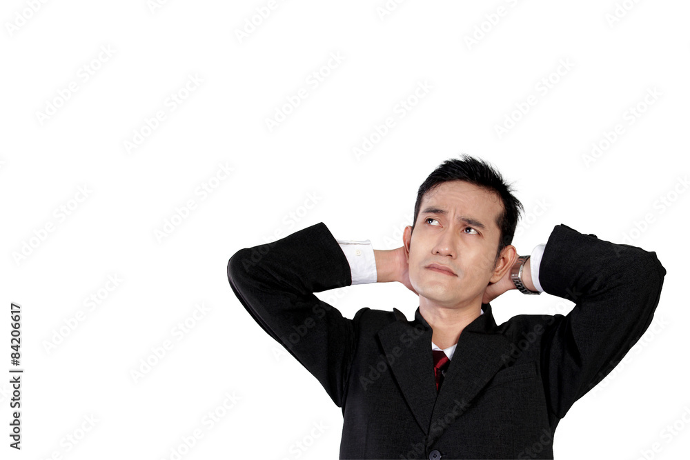 Businessman looking up with thoughtful face, isolated on white Businessman looking up with thoughtful face, isolated on white