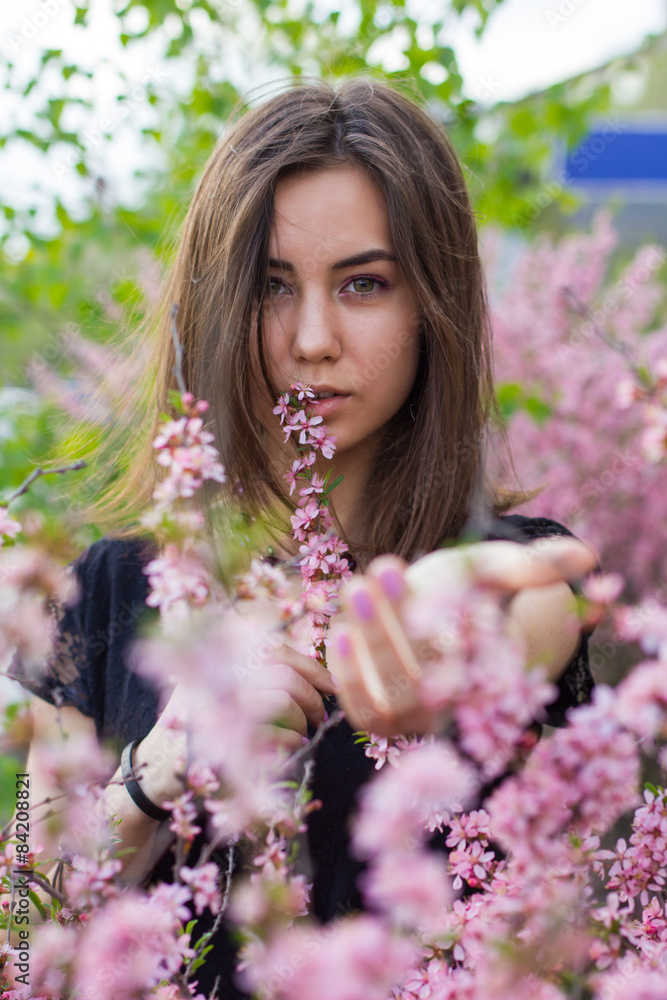portrait of young beautiful girl in flowers portrait of young beautiful girl in flowers