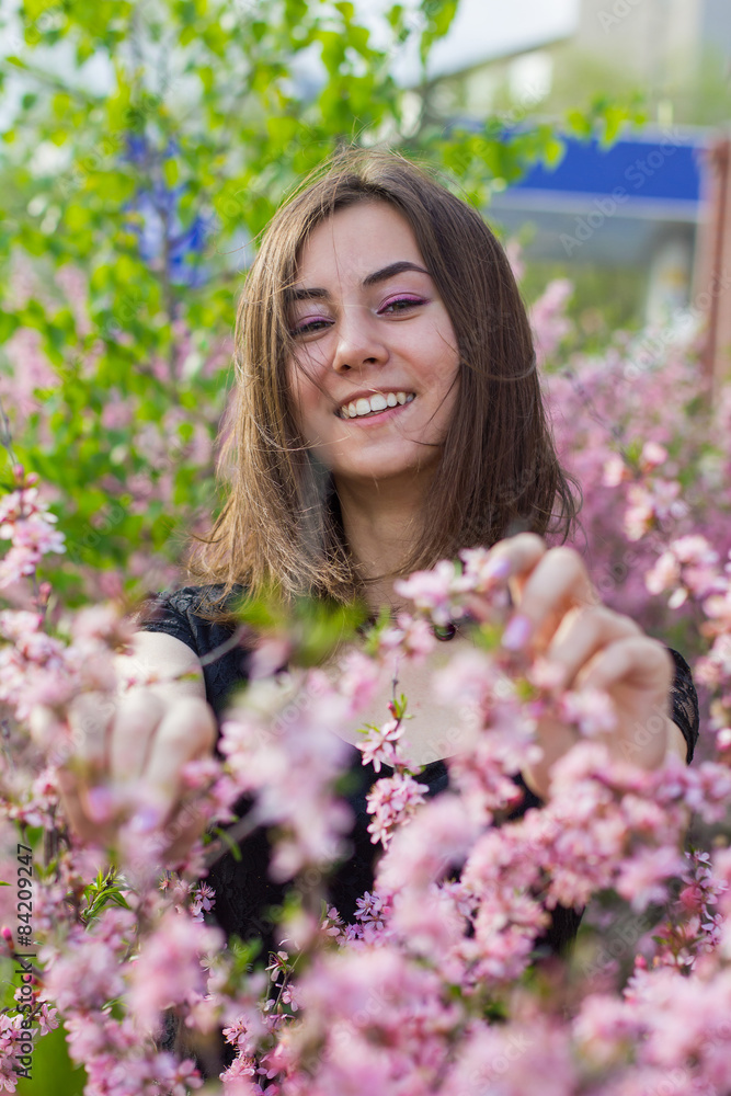 portrait of young beautiful girl in flowers portrait of young beautiful girl in flowers