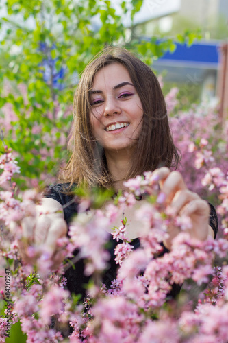 portrait of young beautiful girl in flowers © edinorog12