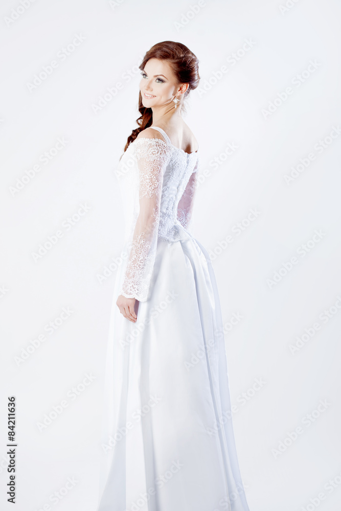 The bride in full growth, wedding dress, holding a bouquet The bride in full growth, wedding dress, holding a bouquet