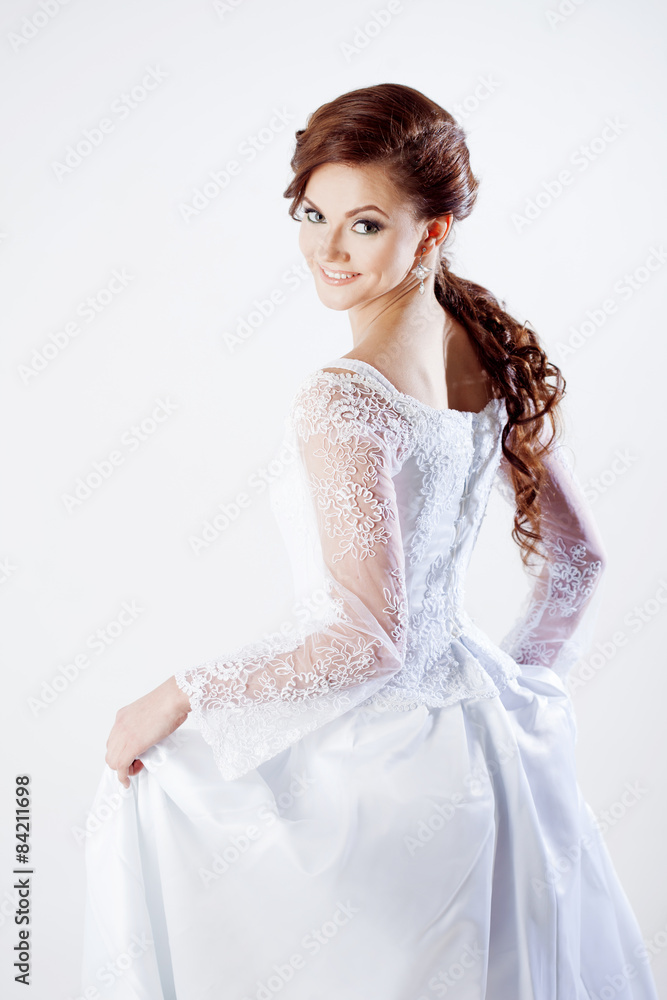 Portrait of happy bride in wedding dress, white background Portrait of happy bride in wedding dress, white background