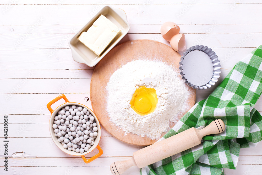 Ingredients for baking on wooden background Ingredients for baking on wooden background