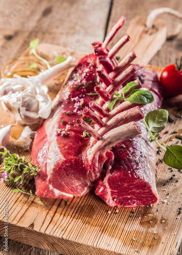 Raw Rectangle Rack of Lamb Chops on Wooden Board