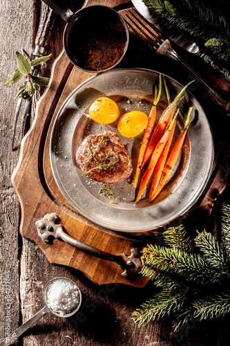 Filet Steak on Metal Plate with Vegetables photo