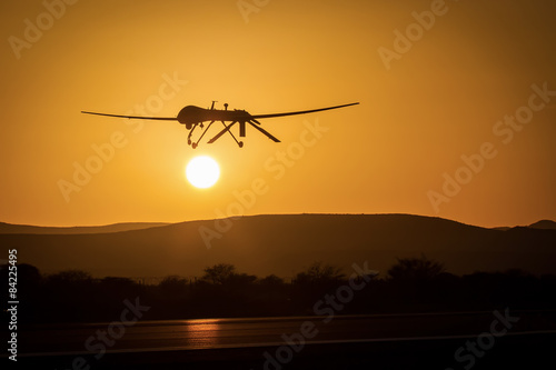 An unmanned drone low pass in sunset