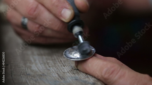 Goldsmith Polishing Silver Rring with Grinder photo