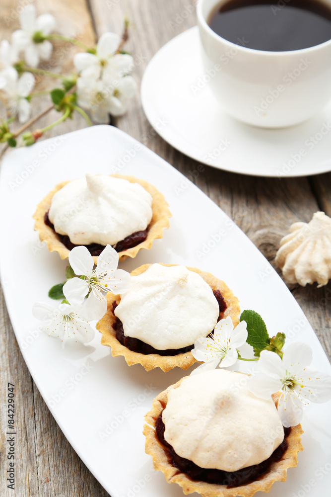 French meringue cookies in tartlet on plate French meringue cookies in tartlet on plate