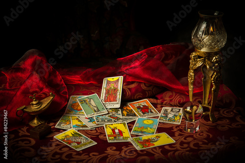 Tarot Cards Spread and scattered on Table Haphazardly photo
