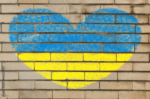 heart shape flag of ukraine on brick wall Fototapet