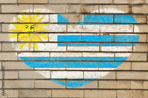 heart shape flag of uruguay on brick wall