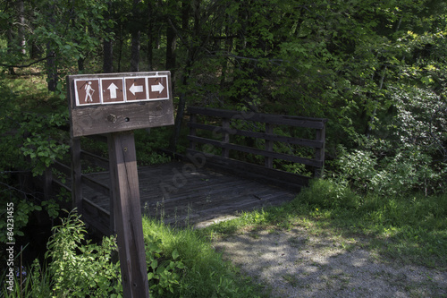 Hiking Trail Sign with foot bridge