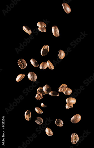 falling coffee beans on the black background