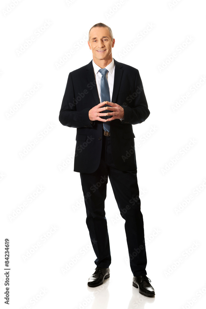Full length businessman with clenched hands