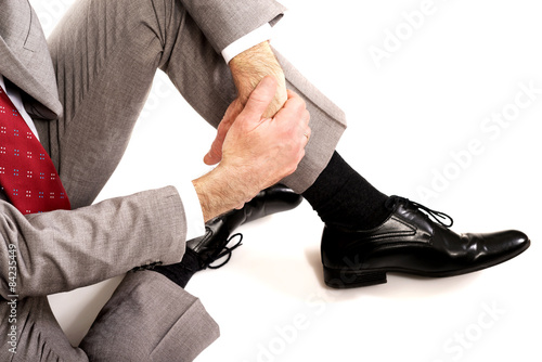 Close up businessman sitting on the floor