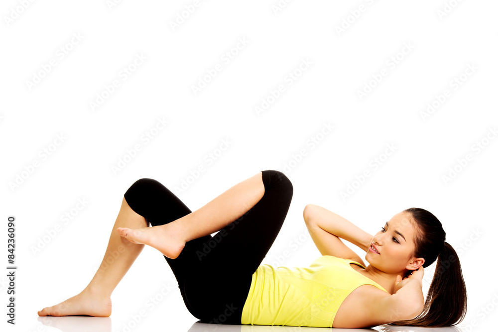 Woman exercising and doing a crunch. Woman exercising and doing a crunch.