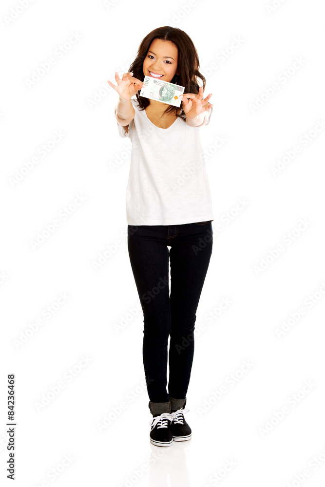 African woman holding polish bill.