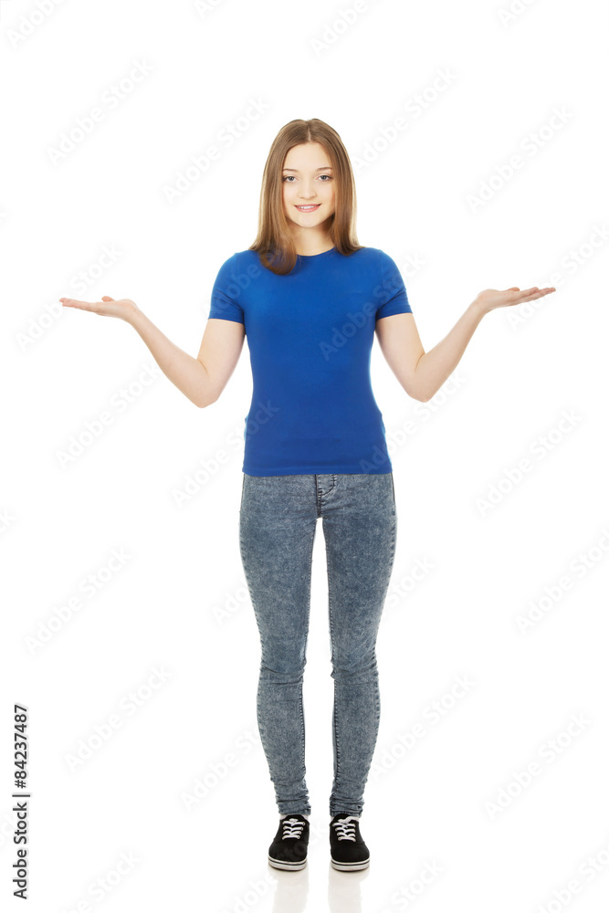 Smiling woman showing something on palms. Smiling woman showing something on palms.
