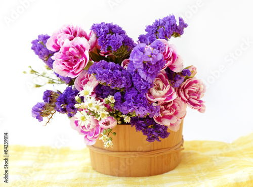 Wallpaper Mural Bunch pink and blue flowers in wooden bucket.  Torontodigital.ca