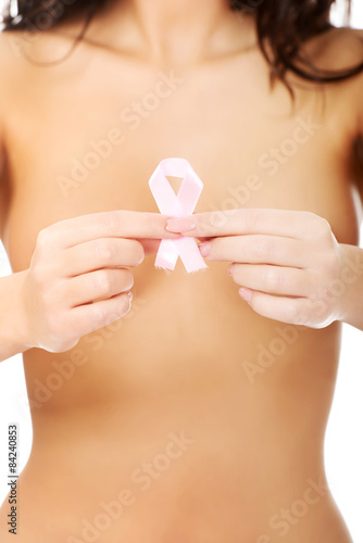 Topless woman with pink ribbon.