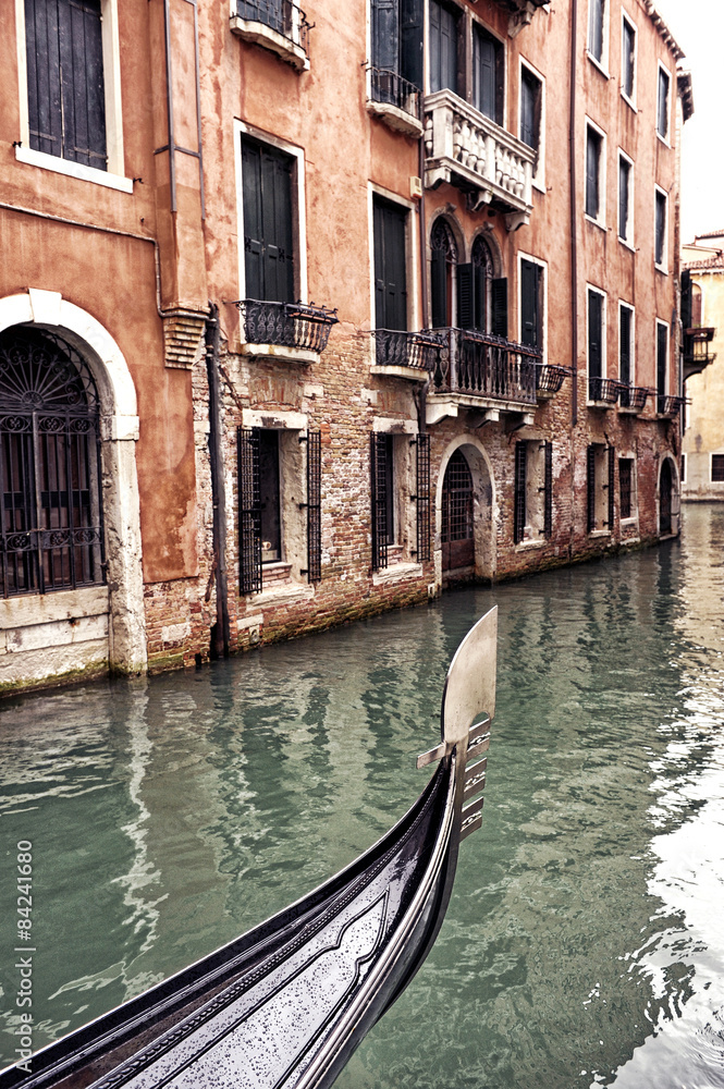 Prow of a Venetian gondola on a rainy day