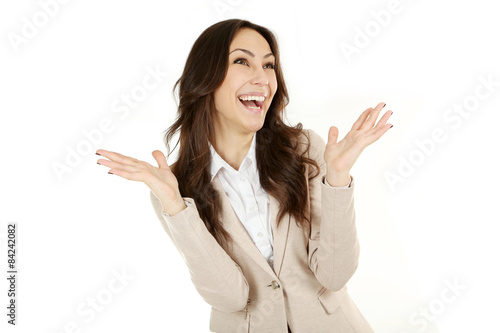 Young beautiful brunette woman surprised on white background
