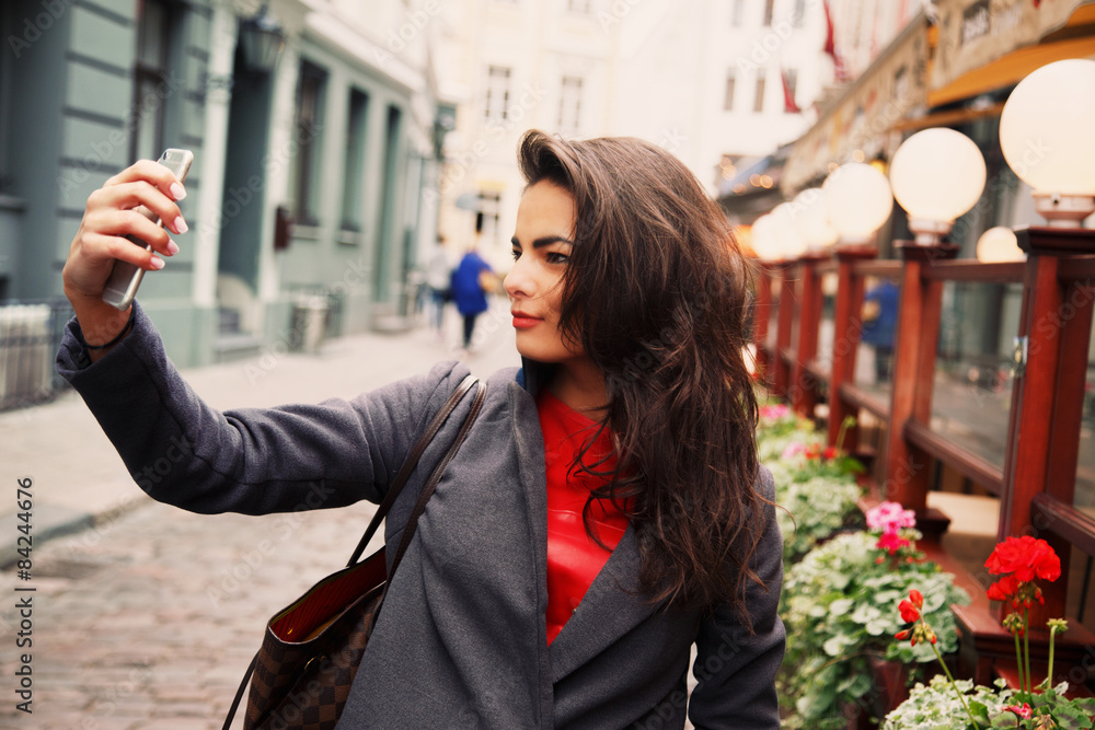 Fototapeta premium Girl with long hair in grey jacket