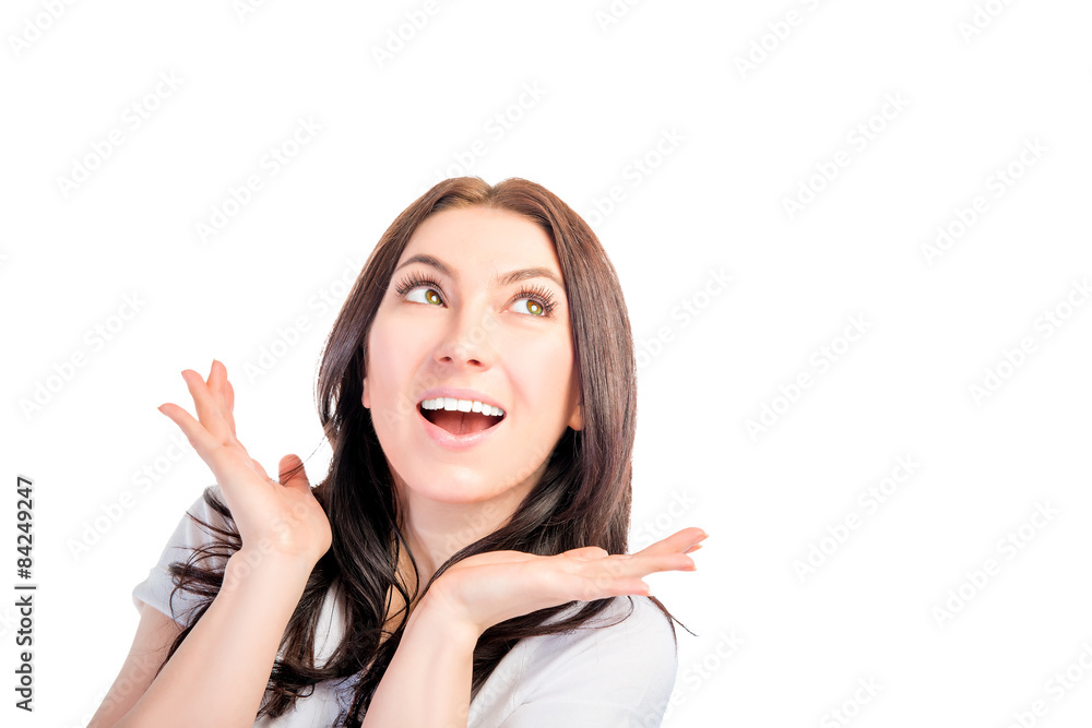 Surprised emotional girl looking at white blank space Surprised emotional girl looking at white blank space