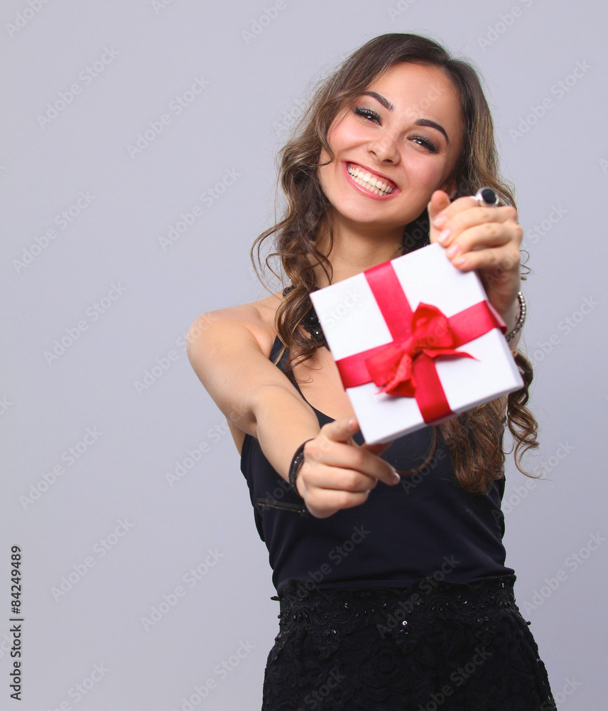 Young woman happy smile hold gift box in hands, isolated over