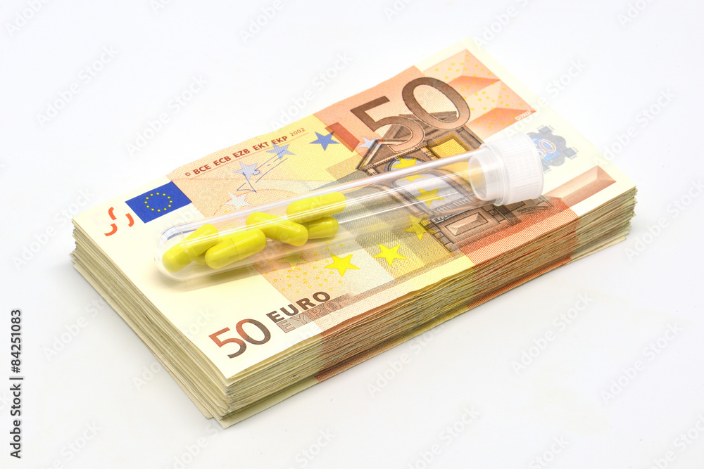 Money pile Euro 50 banknotes with medicine pills Money pile Euro 50 banknotes with medicine pills