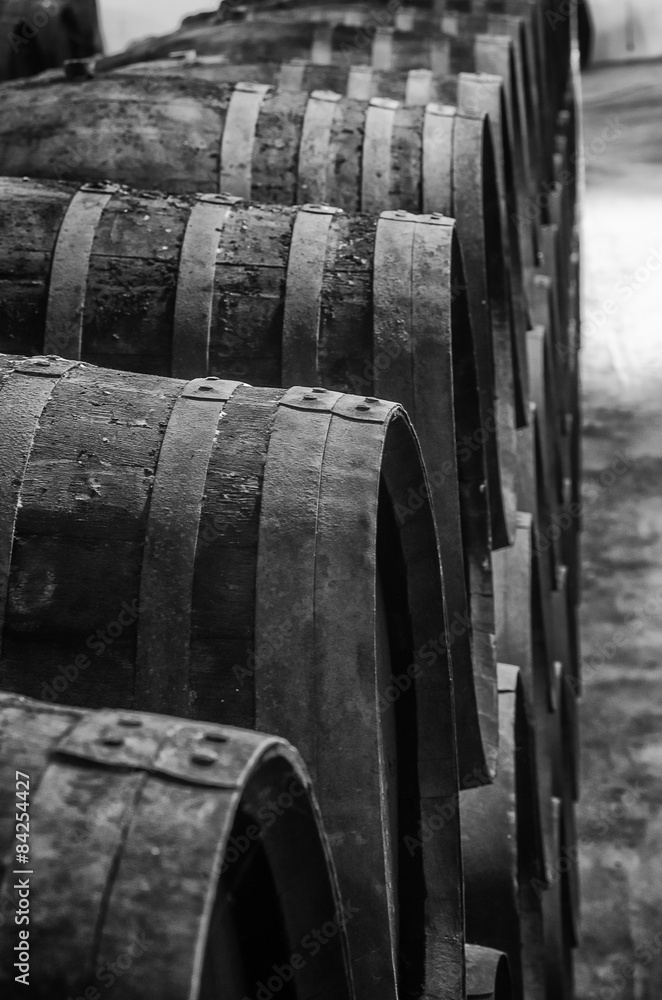 Whisky or wine barrels in black and white