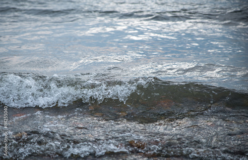 Waves at the seashore. Shallow depth of field.
