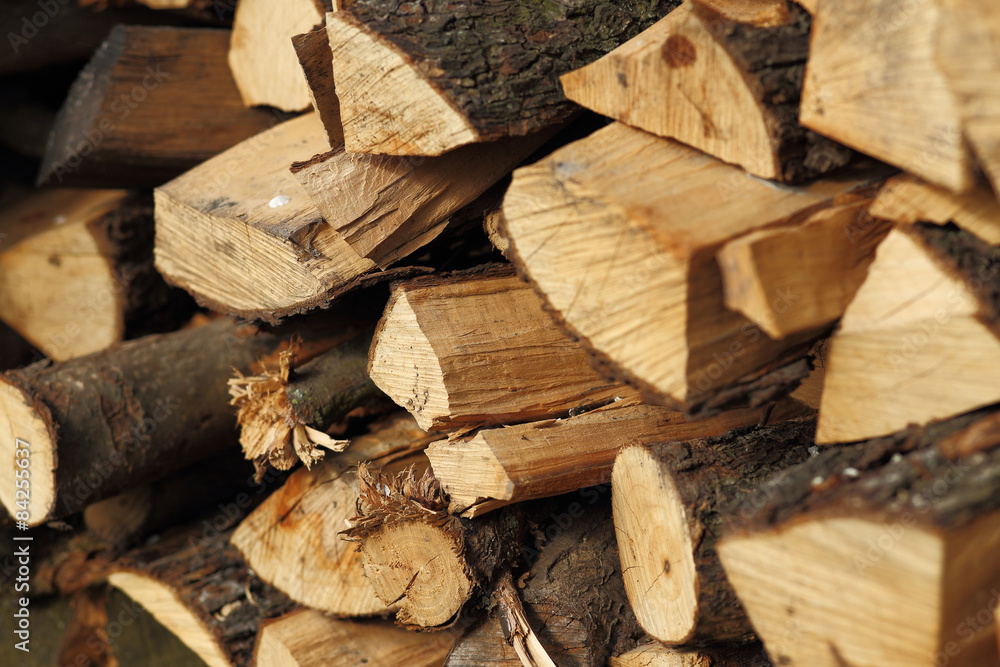 Stack of dry chopped firewood. Background and textures Stack of dry chopped firewood. Background and textures
