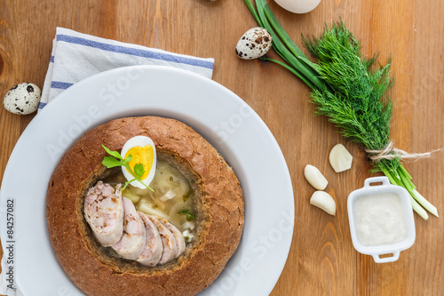 Polish rye soup with eggs and sausage in bread