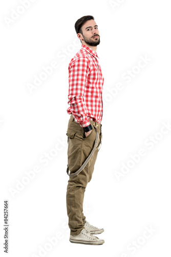 Side view of young bearded hipster with head leaned back