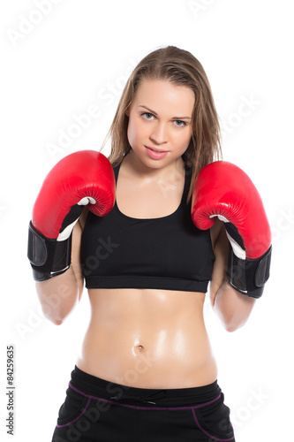 Beautiful woman posing with boxing gloves