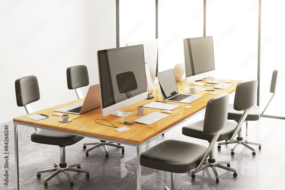 wooden conference table with office accessories and computers wooden conference table with office accessories and computers