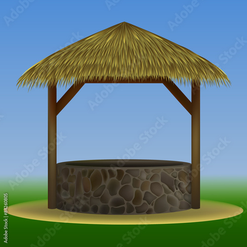 stone well thatched with straw EPS10