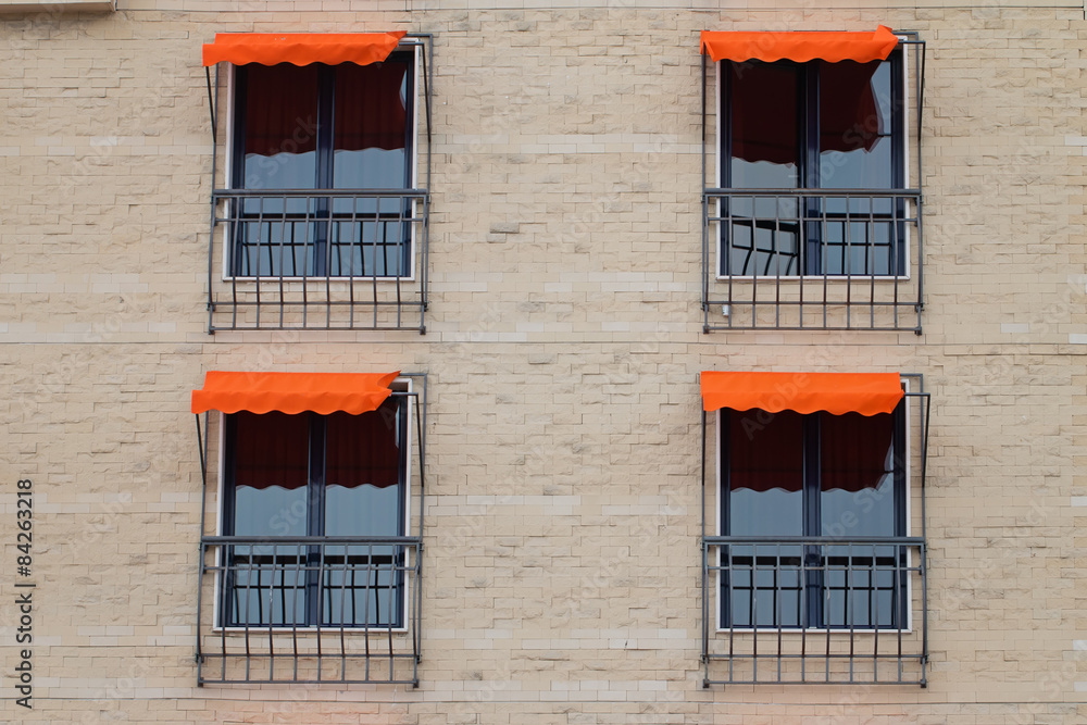 Fototapeta premium Facade Of Building With Orange Awning