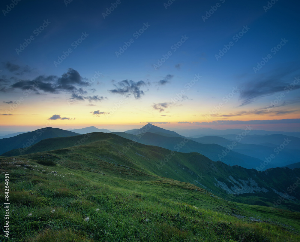 Mountain valley during sunrise. Natural summer landscape.