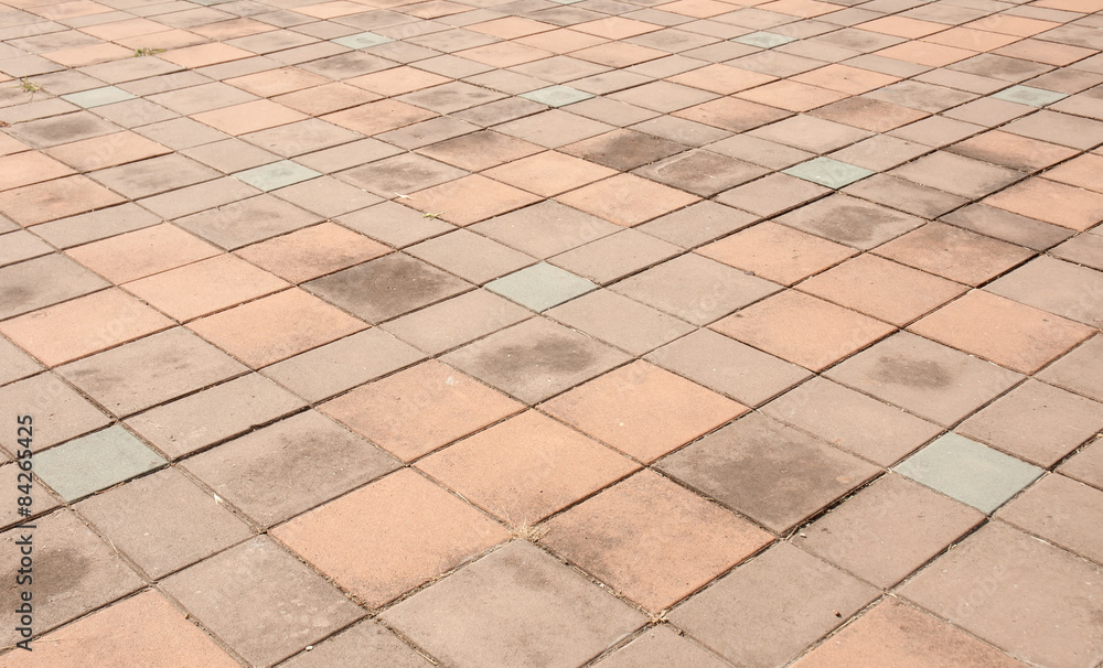 Fototapeta premium patterned paving tiles, cement brick floor background
