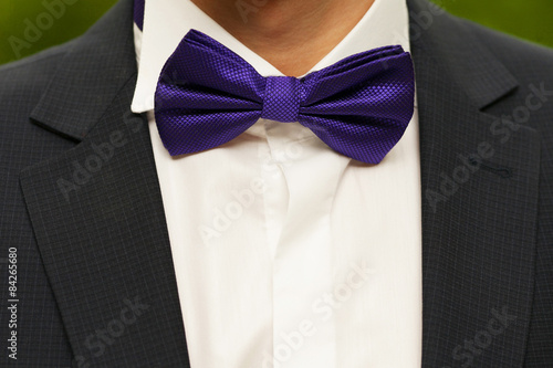 Groom with a purple butterfly