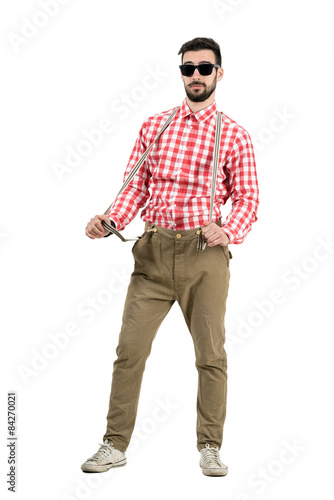 Funny eccentric male artist pulling suspenders isolated 