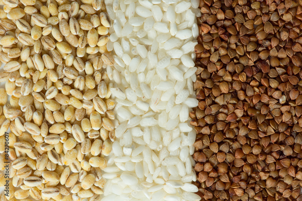 Buckwheat, oatmeal, and rice grains close up