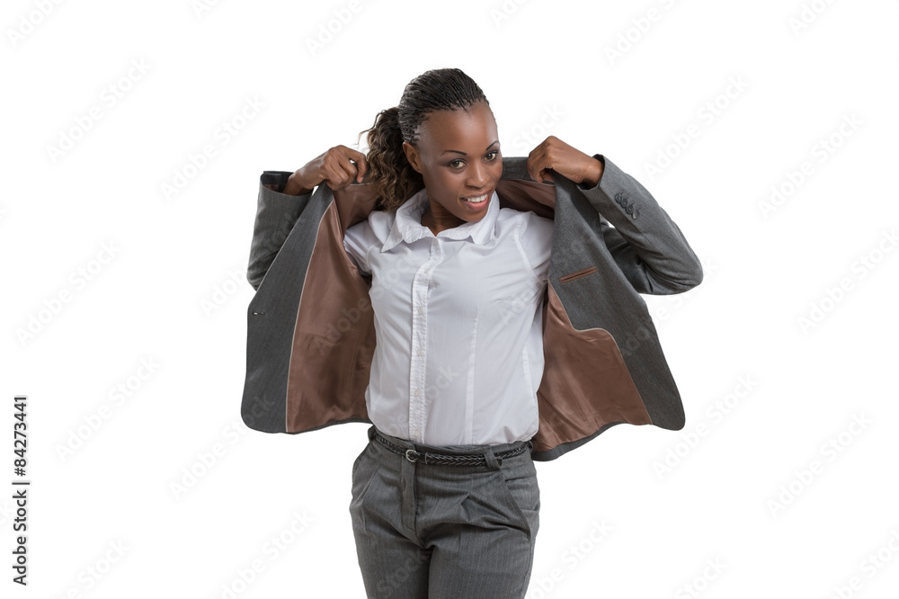 Business woman putting on jacket Stock Photo | Adobe Stock
