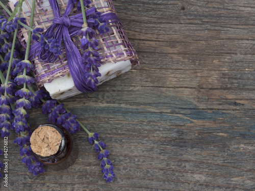 lavender oil with fresh flowers on the wooden table