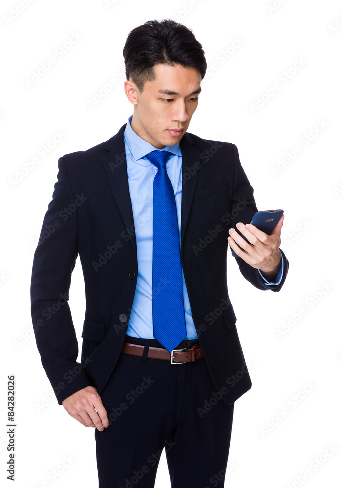 Asian businessman read the message on smart phone Asian businessman read the message on smart phone