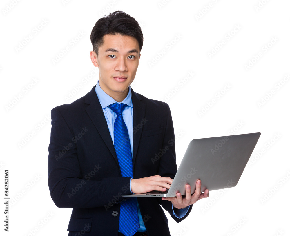 Young businessman use of laptop computer Young businessman use of laptop computer