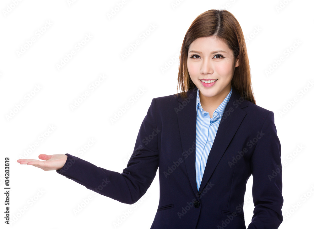 Asian businesswoman with hand showing blank area Asian businesswoman with hand showing blank area
